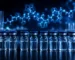 Row of clear research vials with blue caps and a glowing 3D peptide molecular structure, illustrating CJC-1295 and Ipamorelin growth hormone secretagogue research peptides